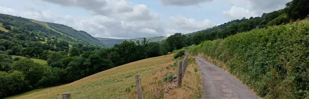 Wide valley with narrow road on right side